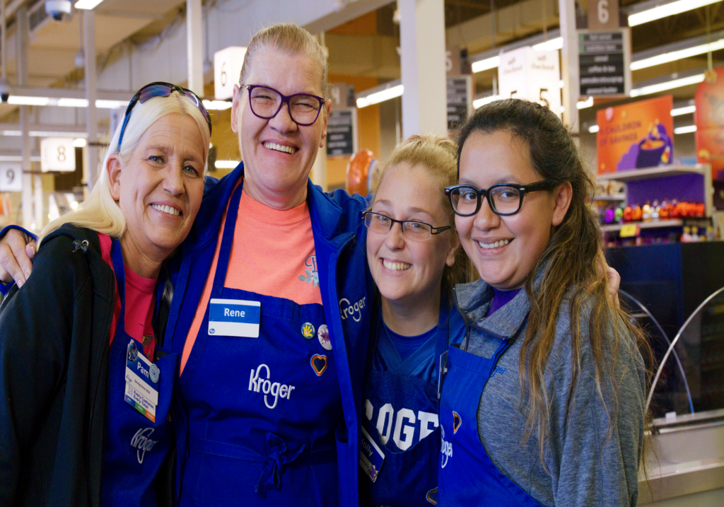 Workers at a Kroger store The Kroger Co.