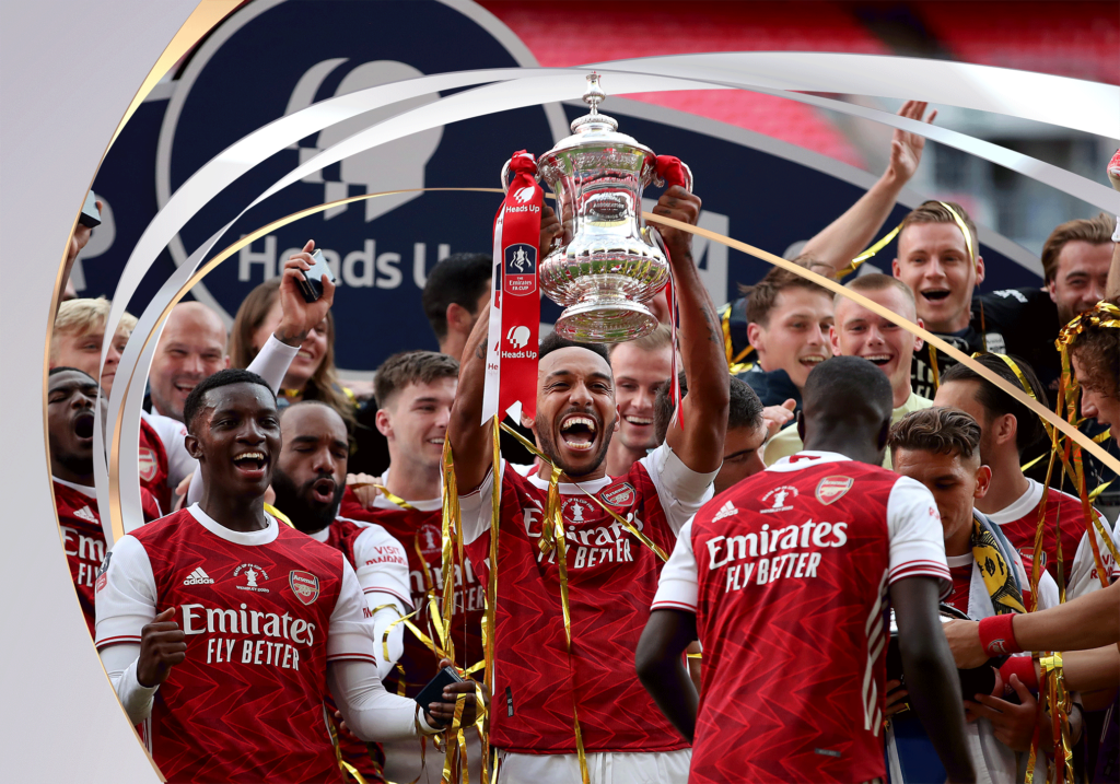 Pierre-Emerick Aubameyang of Arsenal lifts the Emirates FA Cup trophy in 2020 Pool via Getty Images