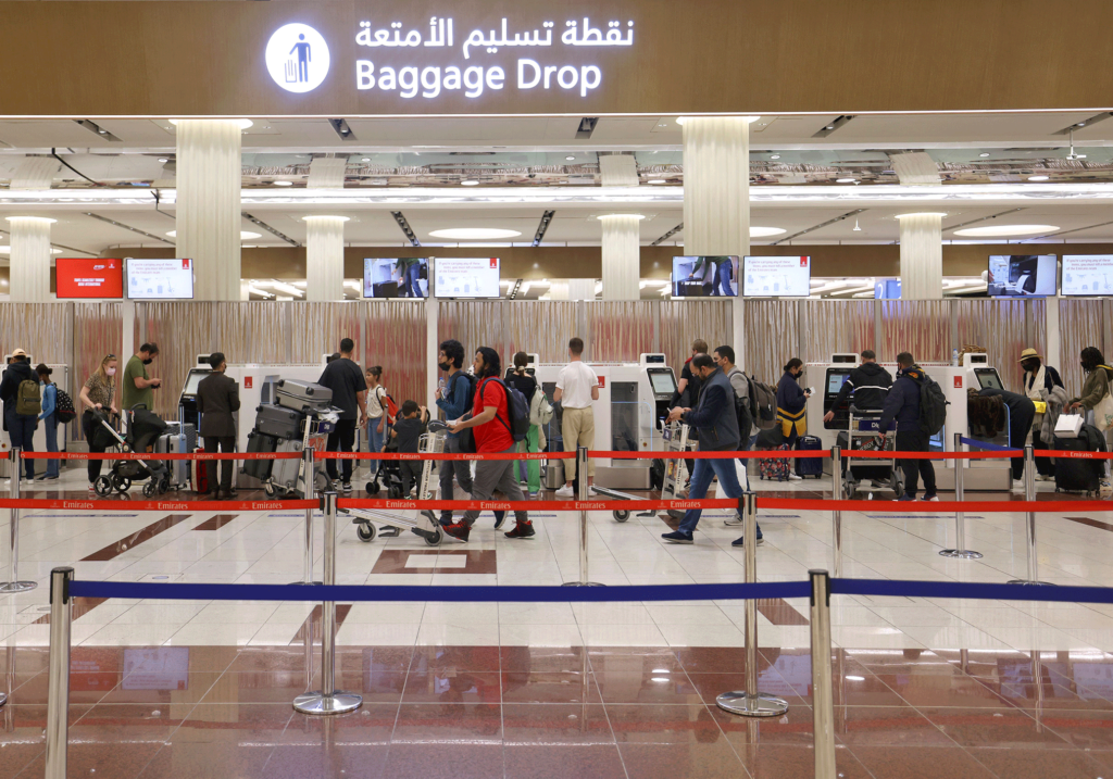 Checking in at Dubai International Airport on 21 February 2022 Image source: AFP via Getty Images