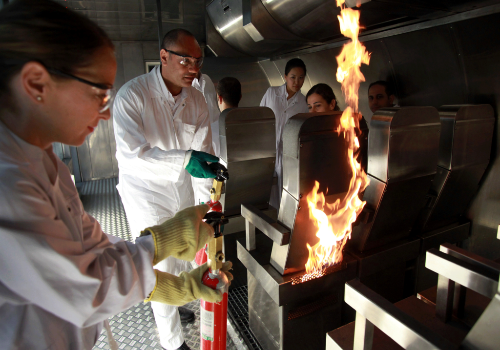 Emirates aircrew members deal with a simulated emergency during training at the Emirates Aviation College in Dubai Image source: Bloomberg via Getty Images
